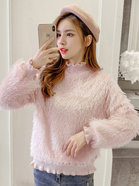 Női pehely pulóver rojtokkal és fürtökkel