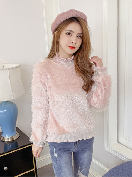 Női pehely pulóver rojtokkal és fürtökkel