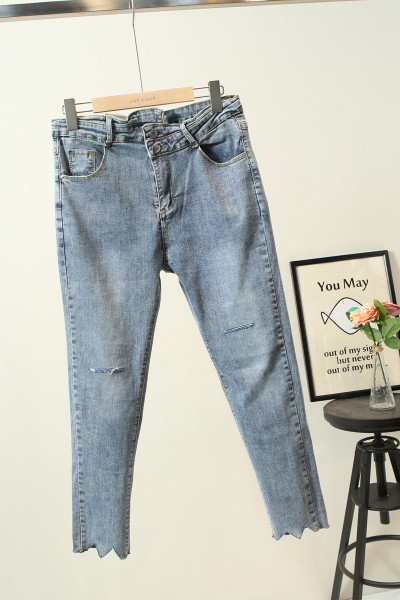 Modern női farmer szakadt motívumokkal - Karcsú modell