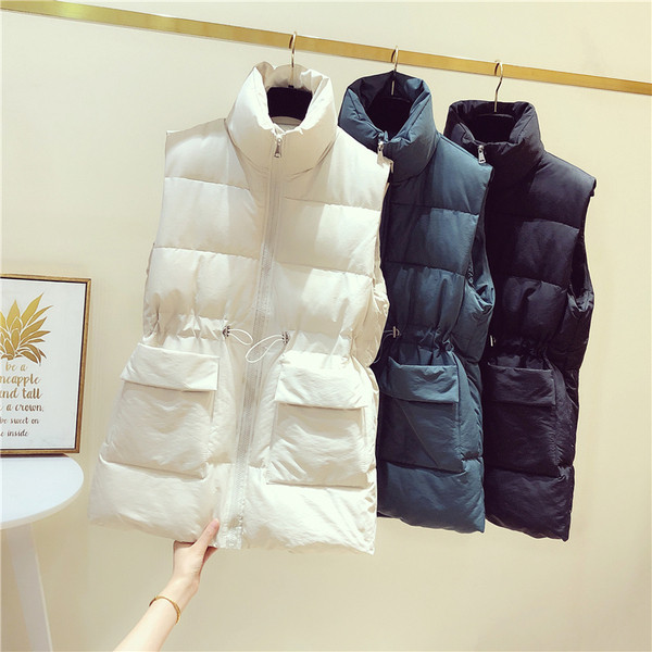 Naiste vabaaja vest taskute ja vöökoha lipsudega