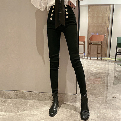 Moodsad naiste mustad püksid kõrge vöökoha ja nööpidega