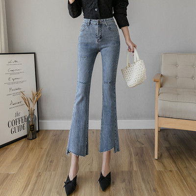 Liibuvad kõrge vöökoha ja rebenenud motiividega naiste teksad - Charlestoni tüüpi