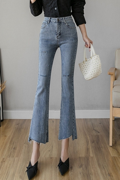 Liibuvad kõrge vöökoha ja rebenenud motiividega naiste teksad - Charlestoni tüüpi