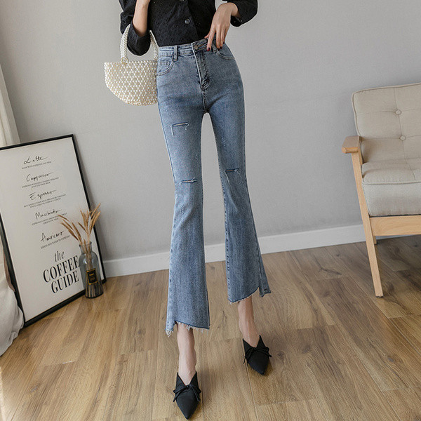 Liibuvad kõrge vöökoha ja rebenenud motiividega naiste teksad - Charlestoni tüüpi