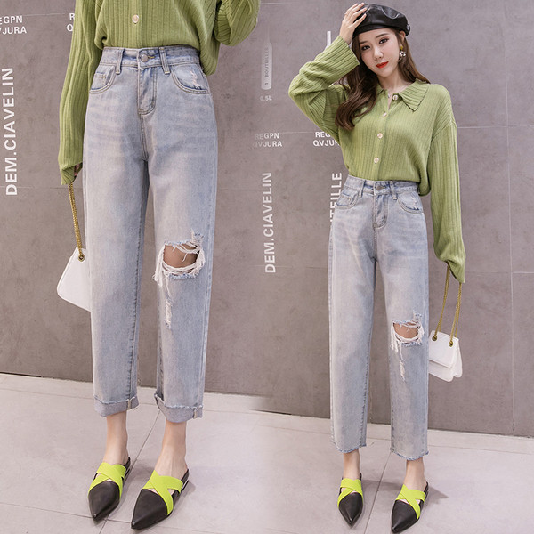 Široke ženske traperice sa visokim strukom i motivom poderanog koljena