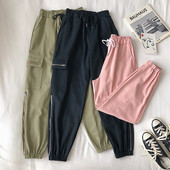 Alkalmi női nadrág elasztikus derékkal, oldalzsebekkel és cipzárral