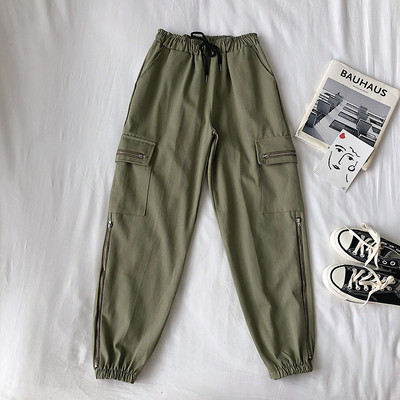 Alkalmi női nadrág elasztikus derékkal, oldalzsebekkel és cipzárral