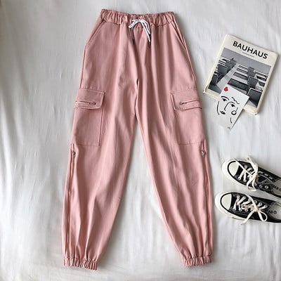 Alkalmi női nadrág elasztikus derékkal, oldalzsebekkel és cipzárral