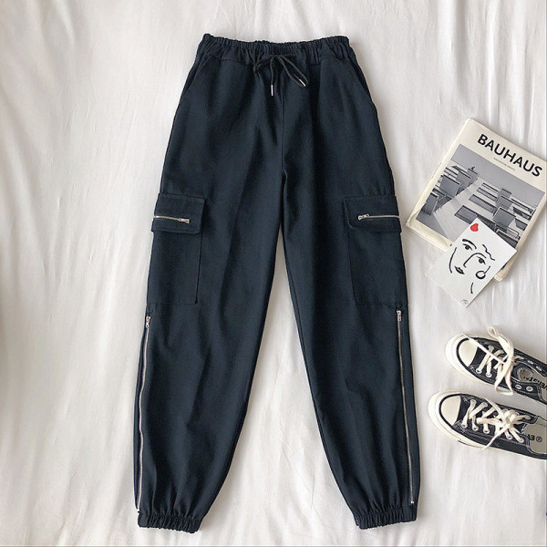 Alkalmi női nadrág elasztikus derékkal, oldalzsebekkel és cipzárral