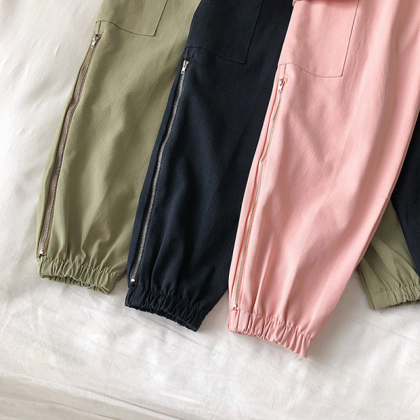 Alkalmi női nadrág elasztikus derékkal, oldalzsebekkel és cipzárral